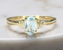 A 9ct yellow gold aquamarine ring, size O. CONDITION REPORT: 0.9g.