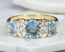 A 9ct yellow gold synthetic blue stone dressing ring, size N. CONDITION REPORT: 2.