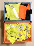A quantity of high visibility work clothing.