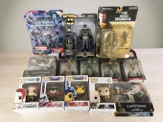 A group of boxed figurines including Marvel, Funko Pop figures, Disney Pixar, Mattel, etc.