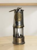 An Eccles Protector Type GR6S miner's safety lamp.