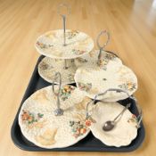 A group of Clarice Cliff for Newport Pottery Celtic Harvest cake stands.