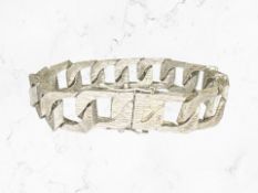 A heavy Sterling silver textured bracelet, length 20 cm CONDITION REPORT: 65.