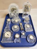 A collection of pressed glass quartz timepieces.
