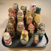 Eighteen Russian babushka nesting dolls.