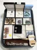 A collection of boxed costume jewellery including pieces by Ortak, lotus pearl earrings,