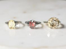 Three Sterling silver rings set with simulated stones.