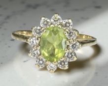A 9ct yellow gold synthetic peridot cluster ring, size O. CONDITION REPORT: 2.1g.