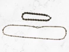A Sterling silver necklace together with rope twist bracelet.
