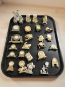 A collection of miniature quartz timepieces.