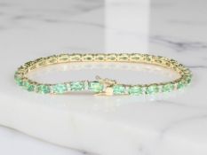 An 18ct yellow gold emerald and diamond bracelet, emerald total 6.34ct, length 18 cm.