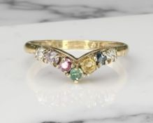 A 9ct yellow gold multi stone dress ring, size R. CONDITION REPORT: 1.5g.