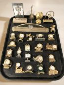 A collection of miniature quartz timepieces.