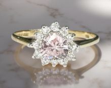 A 9ct yellow gold dress ring set with heart shaped pink synthetic sapphire, size O.