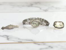 A lady's silver wristwatch signed Carval, a citrine brooch,