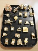 A collection of miniature quartz timepieces.