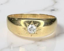 An 18ct yellow gold gypsy-set diamond ring, size S. CONDITION REPORT: 5g.