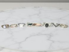 Six Sterling silver / white metal rings set with simulated stones,