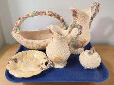 A group of Clarice Cliff for Newport Pottery wares comprising a large basket, two jugs,