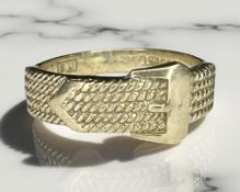 A 9ct yellow gold ring in the style of a belt with buckle, size T.