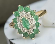 A 9ct yellow gold synthetic emerald cluster ring, size N/O. CONDITION REPORT: 2.2g.