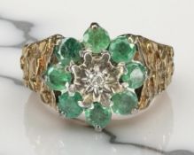 A 9ct yellow gold synthetic emerald cluster ring, size M. CONDITION REPORT: 4.1g.