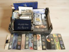 A collection of stamps including Royal Mail mint examples, antiquarian and later postcards, albums,
