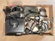 A group of vintage portable lamps and torches.