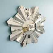 A contemporary frameless sunburst mirror, diameter 111 cm.