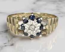 A 9ct yellow gold sapphire cluster ring, size M. CONDITION REPORT: 1.8g.