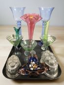 A group of antique and later coloured glass, jelly moulds,