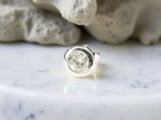 An 18ct white gold diamond earring, 0.32ct.