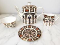 A Royal Crown Derby Old Imari porcelain three-piece tea service, pattern 1128, comprising a teapot,