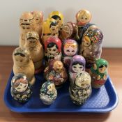 Twenty seven Russian babushka nesting dolls, including nine footballer examples.