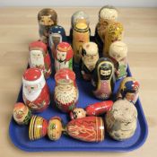 Eighteen Russian babushka nesting dolls.