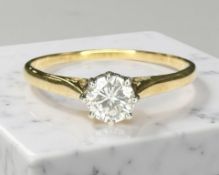 An 18ct yellow gold diamond solitaire ring, approximately 0.2ct, size N/O.