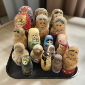Eighteen Russian babushka nesting dolls.
