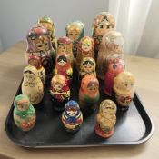 Eighteen Russian babushka nesting dolls.