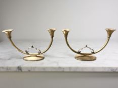 A pair of 20th century Just Andersen two branch light bronze table candelabra, model No.