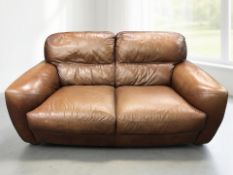 A contemporary stitched brown leather two seater settee, length 180 cm.