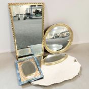 An Art Deco frameless mirror, width 68 cm, and four further mirrors.