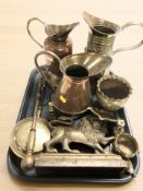 A group of brass and copper jugs, Indian engraved brass planter, lion door stop,