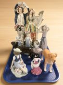 A large Staffordshire figure group, four Lladro figures of children and a further Nao figure,