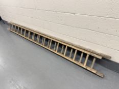 A double wooden extension ladder,
