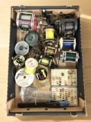 A collection of fishing reels including Shakespeare, Shimano, fishing flies, etc.