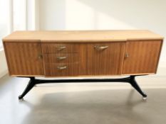 A 20th century teak break-front low Stonehill sideboard on ebonised legs, 169 cm x 45 cm x 80 cm.