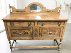 An Edwardian carved oak mirror-back sideboard on barley twist supports, 137 cm x 45 cm x 115 cm.