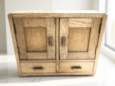 An early 20th century oak double door tabletop cabinet, width 40 cm.