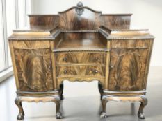 A late Victorian mahogany twin pedestal sunk centre sideboard on claw and ball feet,