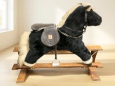 A Mamas & Papas rocking horse.